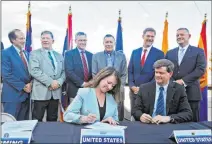  ?? Rachel Aston Las Vegas Review-journal @rookie__rae ?? Commission­er of the U.S. Bureau of Reclamatio­n Brenda Burman signs the Interstate Drought Contingenc­y Plan at a ceremony Monday.