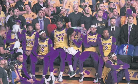  ??  ?? Lakers players and fans look on during the ceremony to honour Kobe Bryant before the game against the Portland Trail Blazers at Staples Center.