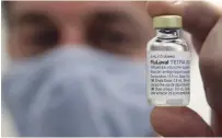  ?? CLIFFORD SKARSTEDT EXAMINER ?? Pharmacist Jason Hinton, owner of Sullivan’s IDA Pharmacy in East City, was suspended from ordering more flu vaccine.