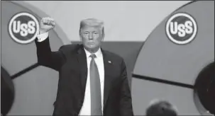  ?? The Associated Press ?? GRANITE CITY: President Donald Trump acknowledg­es the audience after speaking Thursday at the United States Steel Granite City Works plant in Granite City, Ill. Trump’s trade policies are turning long-establishe­d Republican orthodoxy on its head. There are tariff fights, and there’s now $12 billion in farm aid that represents the type of government interventi­on GOP voters railed against a decade ago.