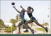  ?? ASHLEY LANDIS — THE ASSOCIATED PRESS FILE ?? Syndel Murillo, 16, left, and Shale Harris, 15, reach for a pass as they try out for the Redondo Union High School girls flag football team on Sept. 1, 2022, in Redondo Beach.