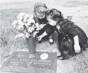  ?? Courtesy of A.J. De La Garza ?? Noelle and Alexi De La Garza, daughters of Inter Miami’s A.J. De La Garza, visit the gravesite of their brother, Luca.