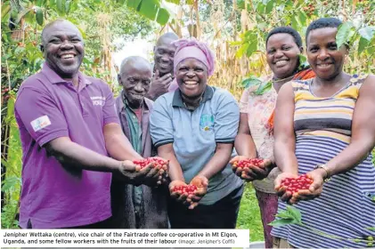  ?? (Image: Jenipher’s Coffi) ?? Jenipher Wettaka (centre), vice chair of the Fairtrade coffee co-operative in Mt Elgon, Uganda, and some fellow workers with the fruits of their labour