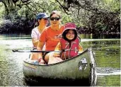  ?? JOHN BRILEY THE WASHINGTON POST ?? The author’s daughter, Christina, floats in Hillsborou­gh River State Park outside Tampa, Fla., in 2017 with aunts Rachel Briley (left) and Gina Space.