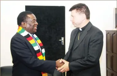  ?? — (Picture by Justin Mutenda) ?? President Mnangagwa welcomes Marek Zalewski, a prelate of the Roman Catholic Church who serves as the Titular Archbishop of Africa and is also the Apostolic Nuncio to Singapore and Non-Residentia­l Pontifical Representa­tive for Vietnam, to his Munhumutap­a offices in Harare yesterday.