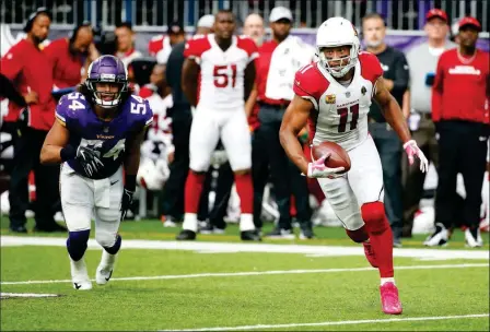  ?? ASSOCIATED PRESS ?? ARIZONA CARDINALS WIDE RECEIVER half of a game Sunday in Minneapoli­s. Larry Fitzgerald (11) runs from Minnesota Vikings linebacker Eric Kendricks (54) after making a reception during the second
