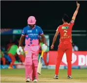  ??  ?? Arshdeep Singh (R) of Punjab Kings celebrates after dismissing Rajasthan Royals’ captain Sanju Samson on the final ball of the match on Monday