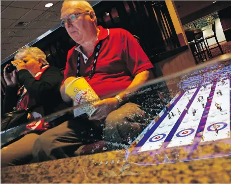  ?? JOHN LOCHER/THE ASSOCIATED PRESS ?? Fans watch the men’s world curling championsh­ip in Las Vegas. Sin City’s desert climate combined with a new NHL team currently in the Stanley Cup Finals and regular internatio­nal curling events a short flight away are increasing traffic from western...