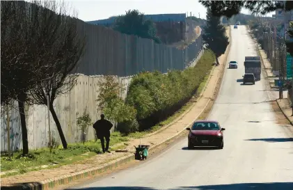  ?? MOHAMMED ZAATARI/AP ?? The wall on the Lebanon-israel border, an area of security tensions, is seen Jan. 21 from the Lebanese village of Kfar Kila.