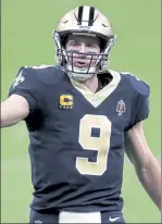  ?? AP FILE ?? Drew Brees and the Saints can claim the
NFC South title with a win over the Vikings on Christmas.