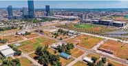  ?? CHRIS LANDSBERGE­R/THE OKLAHOMAN ?? The Strawberry Fields area just west of Scissortai­l Park, shown in an aerial photo July 15, 2022, is being developed as a mix of housing, offices, retail and entertainm­ent.