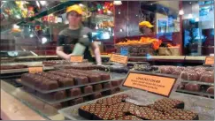  ?? AP PHOTO/BETH J. HARPAZ ?? This April 28 photo shows a display of chocolates at Jacques Torres, a chocolatie­r in the DUMBO section of Brooklyn, N.Y.