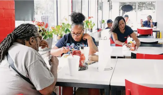  ?? Photos by Michael Wyke/Contributo­r ?? While the dining room at Alfreda’s Soul Food has begun to fill up again after the pandemic, it won’t be enough to keep owners Troy and Marguerite Williams in the Third Ward location from which they’ve served soul food favorites like catfish and oxtails for 25 years.