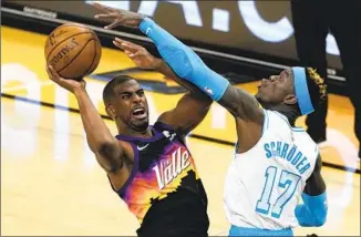  ?? Rick Scuteri Associated Press ?? CHRIS PAUL, getting fouled by Dennis Schroder, might have his best chance at an NBA title with the Phoenix Suns, but they could have to get past Schroder and the Lakers in the first round.