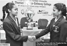  ??  ?? The two captains with the Trophy for the under 20 girls friendly match