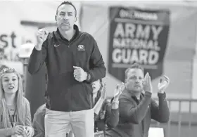  ?? Arena. BRYAN TERRY/THE OKLAHOMAN ?? Tuttle coach Brian Lester pumps his fist during a Class 4A girls basketball state tournament semifinal game against Weatherfor­d on March 11 at State Fair