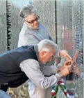  ?? MICHAEL SEARS/JOURNAL SENTINEL FILE ?? Bruno Burkle of Oconomowoc makes an etching of a name on the Moving Vietnam Veterans Memorial Wall when it was in Oconomowoc in 2015. Groundbrea­king for the Washington Vietnam memorial was held on this date in 1982.