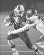  ?? /8" %FNPDSBU (B[FUUF #&/ (0'' r !/8"#&/(0'' ?? Luke Miller (1) tries to evade Conway’s Riley White (31) in the first quarter Friday, at Wolverine Stadium in Centerton.