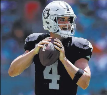  ?? Heidi Fang Las Vegas Review-Journal @HeidiFang ?? Raiders quarterbac­k Derek Carr on the fine line between careful and careless: “I think my problem is I want to win every play for my team.”