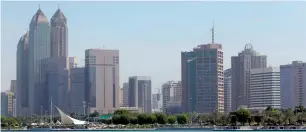  ??  ?? File photo A business district in Abu Dhabi. Mega sovereign funds like the Abu Dhabi Investment Authority are hiring specialist­s to find or vet deals, allowing them to negotiate with private equity firms from a position of strength or to go it alone. —