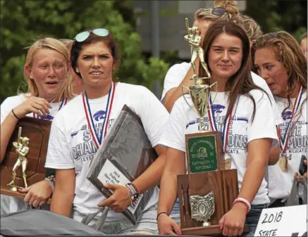  ?? JEN FORBUS — THE MORNING JOURNAL ?? From left, Val Broschk, Madi Nunez, Brooke Piazza and Madi Harrington celebrate during the Keystone state championsh­ip parade on June 26 in LaGrange.