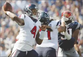  ?? The Associated Press ?? Houston Texans quarterbac­k Deshaun Watson (4), seen here delivering a pass against the New England Patriots during NFL action last month, has yet to face a challenge like the one he’ll get on Sunday in Seattle against the Seahawks.