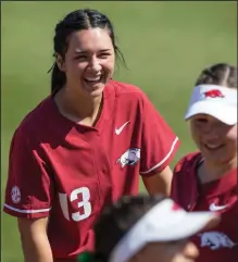  ?? (NWA Democrat-Gazette/Ben Goff) ?? As a teenager, Arkansas catcher Kayla Green served as a parental figure for her two younger siblings while her mother battled substance abuse.