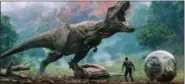  ?? UNIVERSAL PICTURES VIA AP ?? This image released by Universal Pictures shows a scene from “Jurassic World: Fallen Kingdom.”