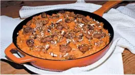  ?? ELIZABETH KARMEL/AP ?? This sweet potato dish is highlighte­d with pecans and bourbon.
