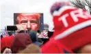  ?? Photograph: Shannon Stapleton/Reuters ?? Donald Trump’s face was projected on a screen as he spoke to supporters at the 6 January rally in Washington.