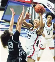  ?? David Butler II / Associated Press ?? UConn’s Olivia Nelson-Ododa (20) shoots against Georgetown on Jan. 23 in Storrs.