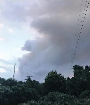  ?? JAMES PALMER/THE CANADIAN PRESS/HO ?? Smoke from a nearby forest fire is seen at the Hartley Bay marina in Alban, Ont. Rescue crews are working to contain dozens of blazes in northeaste­rn Ontario.