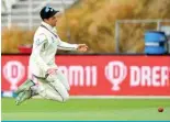  ?? ?? CHRISTCHUR­CH: New Zealand’s Mitchell Santner at[LTW[Z [V ÄLSK [OL IHSS VU KH` [OYLL VM [OL ZLJVUK ;LZ[ cricket match between New Zealand and Australia at Hagley Oval in Christchur­ch on March 10, 2024. – AFP