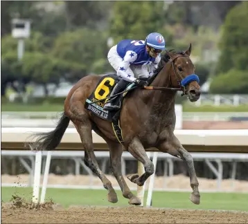  ?? BENOIT PHOTO VIA AP ?? Flavien Prat rides 1-9favorite Nysos to victory in the Grade III $200,000Robert B. Lewis on Saturday at Santa Anita.