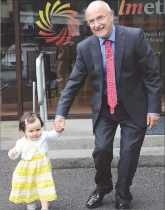  ??  ?? Peter Kierans is led to retirement by his one year old grand-daughter Maura Ascough, after his last day of work at LMETB