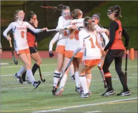  ?? THOMAS NASH — DIGITAL FIRST MEDIA ?? Members of the Perkiomen Valley field hockey team celebrate after Danielle Hamm (30) scored a goal early in the second half of Tuesday’s state playoff game.