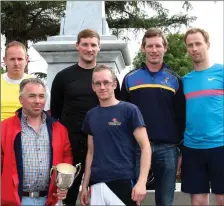  ??  ?? Callinafer­cy Senior men being presented with a perpetual trophy by Mike McKenna after winning the Senior Mens race today in their home regatta (front) Mike McKenna and Ciaran O Sullivan (back from left) James O Sullivan, Paul Sheehan, Maurice Sheehan...