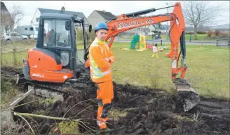  ??  ?? Plant operator Alasdair Morrison of RS MacColl and Son (Appin) completed the drainage work on the site of Appin Young Families Group’s proposed play park.