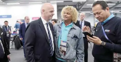  ?? — AFP ?? KAZAN: FIFA president Gianni Infantino (L) speaks with Colombia’s former midfielder Carlos Valderrama (C) ahead of the 2017 Confederat­ions Cup group A football match between Portugal and Mexico at the Kazan Arena in Kazan yesterday.