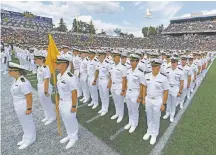  ?? TERRANCE WILLIAMS/ASSOCIATED PRESS ?? The Brigade of Midshipmen stands at attention during the national anthem before the Navy-Air Force game Saturday in Annapolis, Md.
