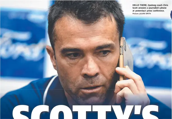  ?? Picture: JULIAN SMITH ?? HELLO THERE: Geelong coach Chris Scott answers a journalist’s phone at yesterday’s press conference.