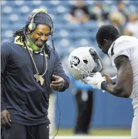  ?? ELAINE THOMPSON/THE ASSOCIATED PRESS FILE ?? Broadcaste­r Greg Papa hinted on his radio show that the Raiders are interested in bringing Marshawn Lynch, left, out of retirement.