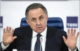  ?? PAVEL GOLOVKIN — THE ASSOCIATED PRESS FILE ?? In this Friday file photo, Russian Sports Minister Vitaly Mutko gestures during a news conference in Moscow, Russia. As head of the 2018 World Cup, Vitaly Mutko is central to the success of FIFA’s showpiece event and enjoys privileged access to FIFA...