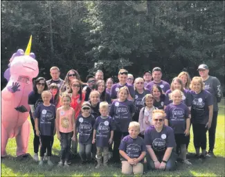  ?? PHOTO PROVIDED ?? Mascot Sophie the Unicorn poses with a group of walkers at last year’s Walk to End Epilepsy.