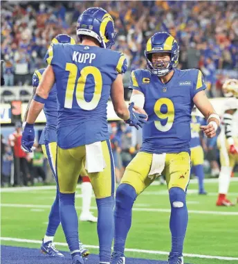  ?? GETTY IMAGES ?? Matthew Stafford and Cooper Kupp of the Rams celebrate after they connected on an 11-yard touchdown in the fourth quarter against the 49ers.