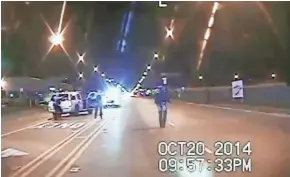  ?? CHICAGO POLICE DEPARTMENT ?? Laquan McDonald (right) walks down the street moments before being shot by officer Jason Van Dyke in Chicago in October 2014, as seen in a frame grab from dash-cam video.