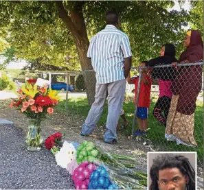  ?? — AP ?? Community support: Flowers from well-wishers left outside the apartment complex in Boise where Kinner (inset) attacked the children.