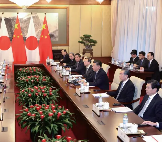  ??  ?? Chinese President Xi Jinping meets with Japanese Prime Minister Shinzo Abe at the Diaoyutai State Guesthouse, Beijing, October 26, 2018