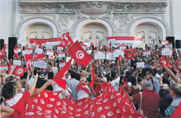  ?? Reuters ?? Protesters shout slogans during a rally, demanding equal inheritanc­e rights for women, in Tunis, on Monday
