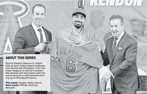  ?? JAYNE KAMIN-ONCEA/GETTY IMAGES ?? Angels owner Arte Moreno and general manager Billy Eppler look on as All-Star infielder Anthony Rendon is presented his jersey after the free agent signed a $245 million deal.